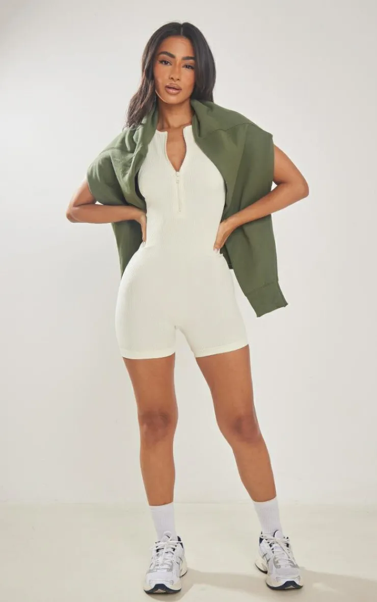 PrettyLittleThing Unitards*Petite Snatched Rib Zip Up Front Unitard