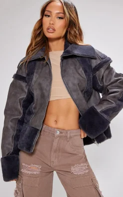 PrettyLittleThing Faux Fur Coats*Petite Distressed PU & Fur Contrast Jacket