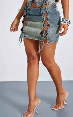 Online PrettyLittleThing Petite Lace Up Detail Denim Mini Skirt Indigo Vintage Wash
