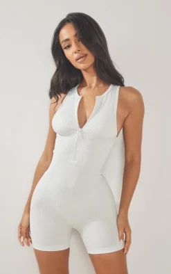 PrettyLittleThing Unitards*Petite Snatched Rib Zip Up Front Unitard