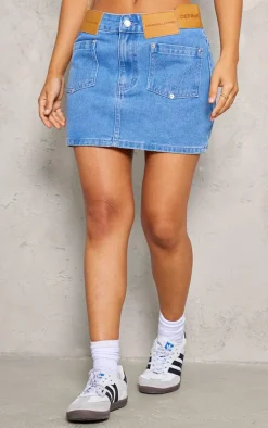 Petite Mid Blue Wash Denim Low Rise Badge Detail Mini Skirt