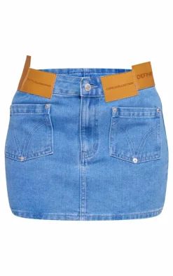 Petite Mid Blue Wash Denim Low Rise Badge Detail Mini Skirt