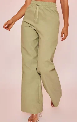 Online PrettyLittleThing Petite Peach Skin Straight Leg Pants Sage