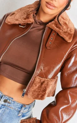 PrettyLittleThing Faux Fur Coats*Petite Faux Fur Trim Buckle Collar Vinyl Cropped Jacket