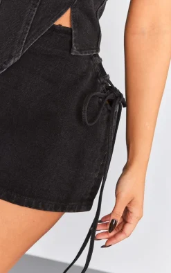 Online PrettyLittleThing Petite Denim Lace Up Mini Skirt Washed Black