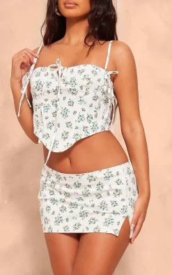 New PrettyLittleThing Petite Denim Floral Print Low Rise Mini Skirt White