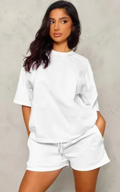 PrettyLittleThing Petite Embossed Bow Detail T-shirt White