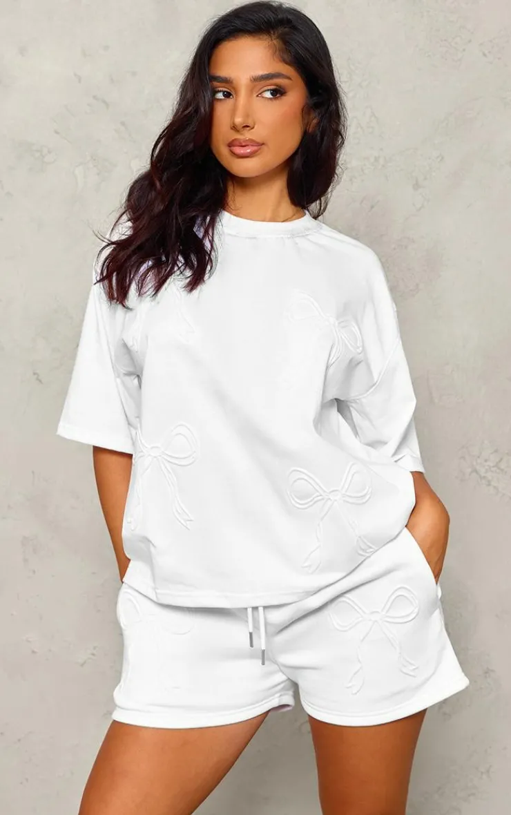 PrettyLittleThing Petite Embossed Bow Detail T-shirt White