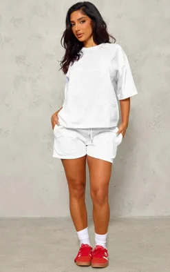 PrettyLittleThing Petite Embossed Bow Detail T-shirt White