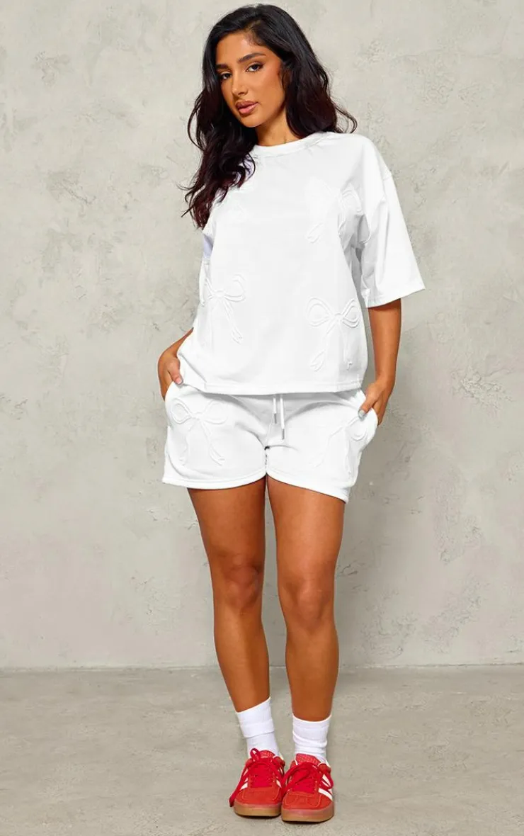 PrettyLittleThing Petite Embossed Bow Detail T-shirt White