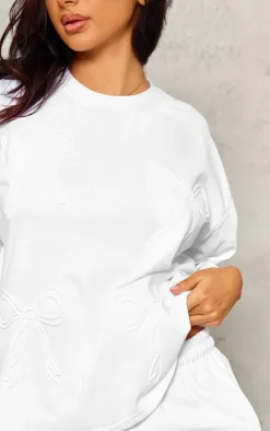 PrettyLittleThing Petite Embossed Bow Detail T-shirt White