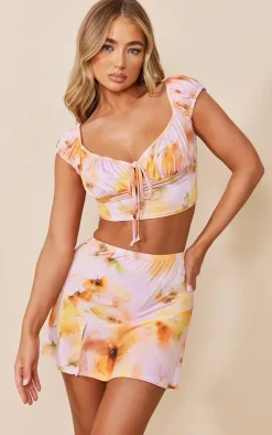 PrettyLittleThing Pink Floral Printed Slinky Split Hem Micro Mini Skirt Cream
