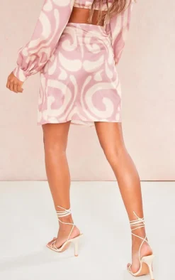 Online PrettyLittleThing Printed Twist Front Split Leg Mini Skirt Pink