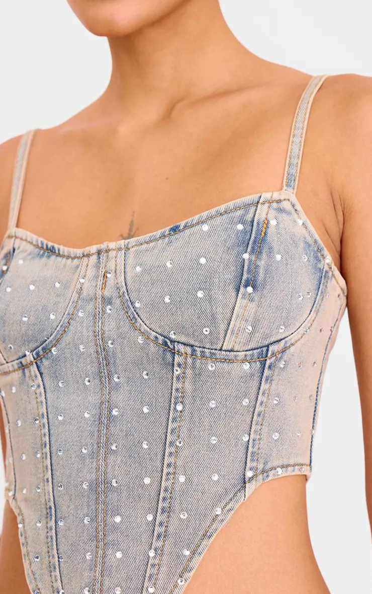 PrettyLittleThing Corsets*Pink Tint Diamante Detail Curved Hem Denim Corset Top