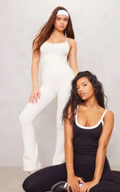 PrettyLittleThing Seamless Gym Wear*PLT SPORT Bone Seamless Laser Cut Strappy Gym Flare Unitard