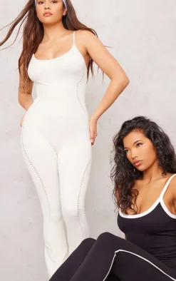 PrettyLittleThing Seamless Gym Wear*PLT SPORT Bone Seamless Laser Cut Strappy Gym Flare Unitard