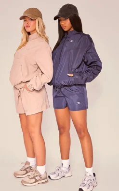 PrettyLittleThing Gym Shorts*PLT SPORT Shell Badge Runner Shorts