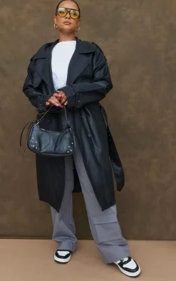 PrettyLittleThing Trench Coats*Plus Faux Leather Statement Buckle Trench Coat