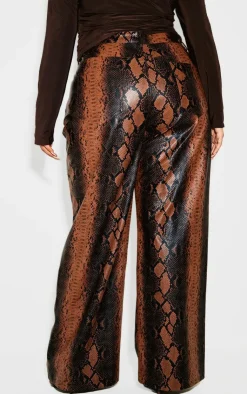 PrettyLittleThing Christmas Shop*Plus Faux Leather Snake Print Wide Leg Pants