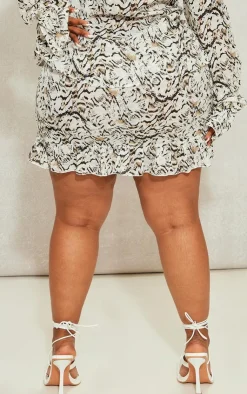 Online PrettyLittleThing Plus Leopard Lace Up Ruffle Hem Skirt Cream