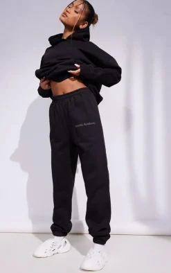 PrettyLittleThing Black Sweatsuits*Premium Coal Sports Academy Puff Print Oversized Sweatpants
