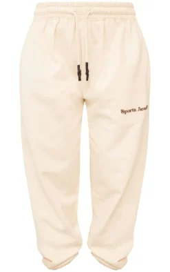 PrettyLittleThing Cream Sweatsuits*Premium Petite Sports Academy Puff Print Oversized Sweatpants