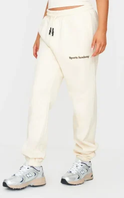 PrettyLittleThing Premium Sports Academy Puff Print Oversized Sweatpants Sand