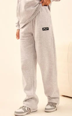 PrettyLittleThing Grey Sweatsuits*Logo Badge Detail Straight Leg Sweatpant