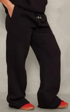 Online PrettyLittleThing Badge Detail Mid Rise Wide Leg Sweatpants Black