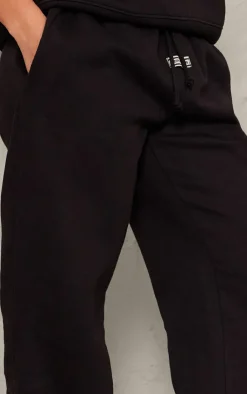 Online PrettyLittleThing Badge Detail Mid Rise Wide Leg Sweatpants Black
