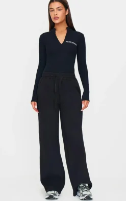 PrettyLittleThing Crinkle Rib Half Zip Bodysuit Black