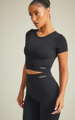 PrettyLittleThing Workout Tops*Sport Metal Badge Sculpt Short Sleeve Crop Top