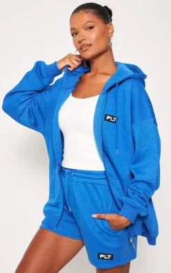 PrettyLittleThing Badge Oversized Runner Shorts Blue