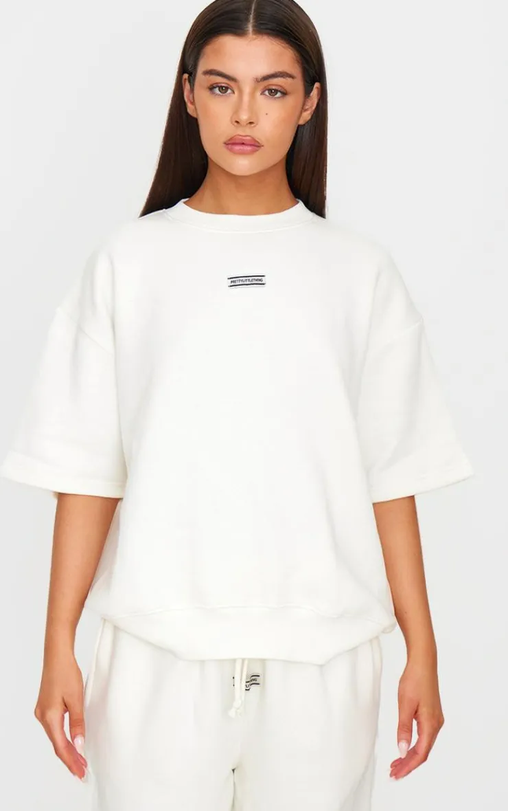 Best PrettyLittleThing Badge Detail Oversized Short Sleeve Sweatshirt Cream