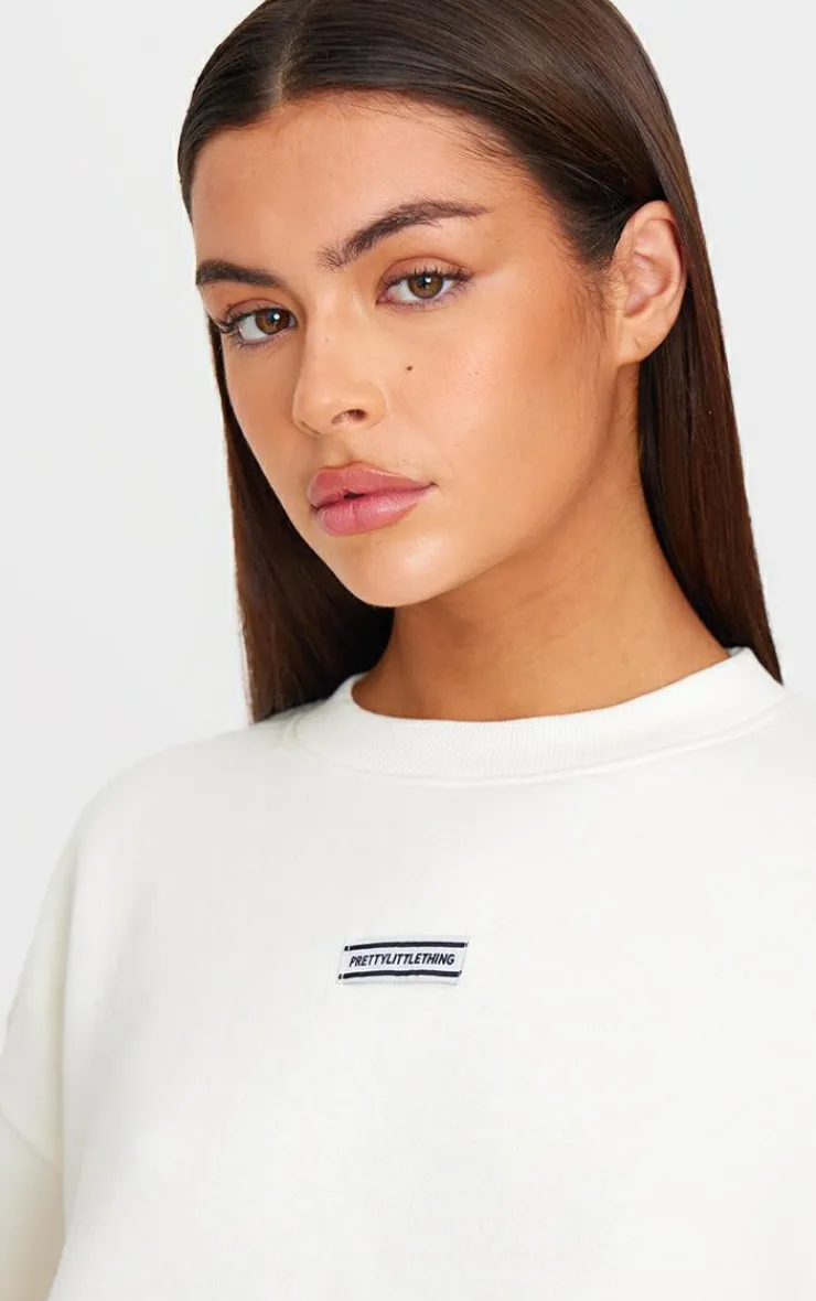 Best PrettyLittleThing Badge Detail Oversized Short Sleeve Sweatshirt Cream