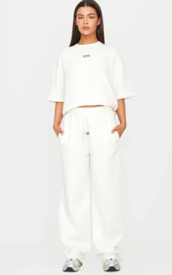 Sale PrettyLittleThing Badge Detail Mid Rise Wide Leg Sweatpants Cream