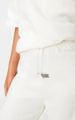 Sale PrettyLittleThing Badge Detail Mid Rise Wide Leg Sweatpants Cream