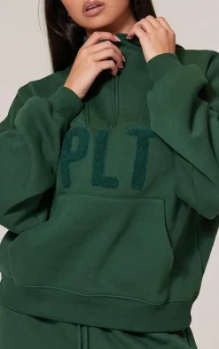 Sale PrettyLittleThing Borg Applique Quarter Zip Sweatshirt Forest Green