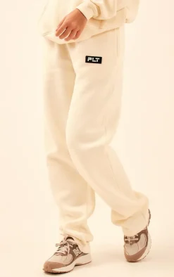 PrettyLittleThing Cream Sweatsuits*Logo Badge Detail Straight Leg Sweatpants