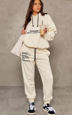 PrettyLittleThing Cream Sweatsuits*Logo Graphic Print Sweatpants