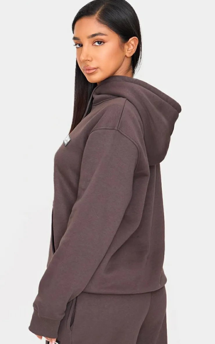 PrettyLittleThing Graphic Sweatsuits*Petite Badge Detail Oversized Hoodie