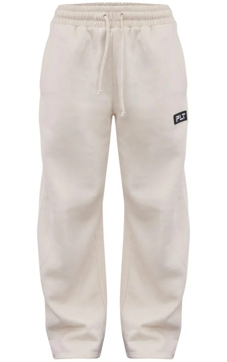 PrettyLittleThing Cream Sweatsuits*Petite Badge Detail Straight Leg Sweatpants
