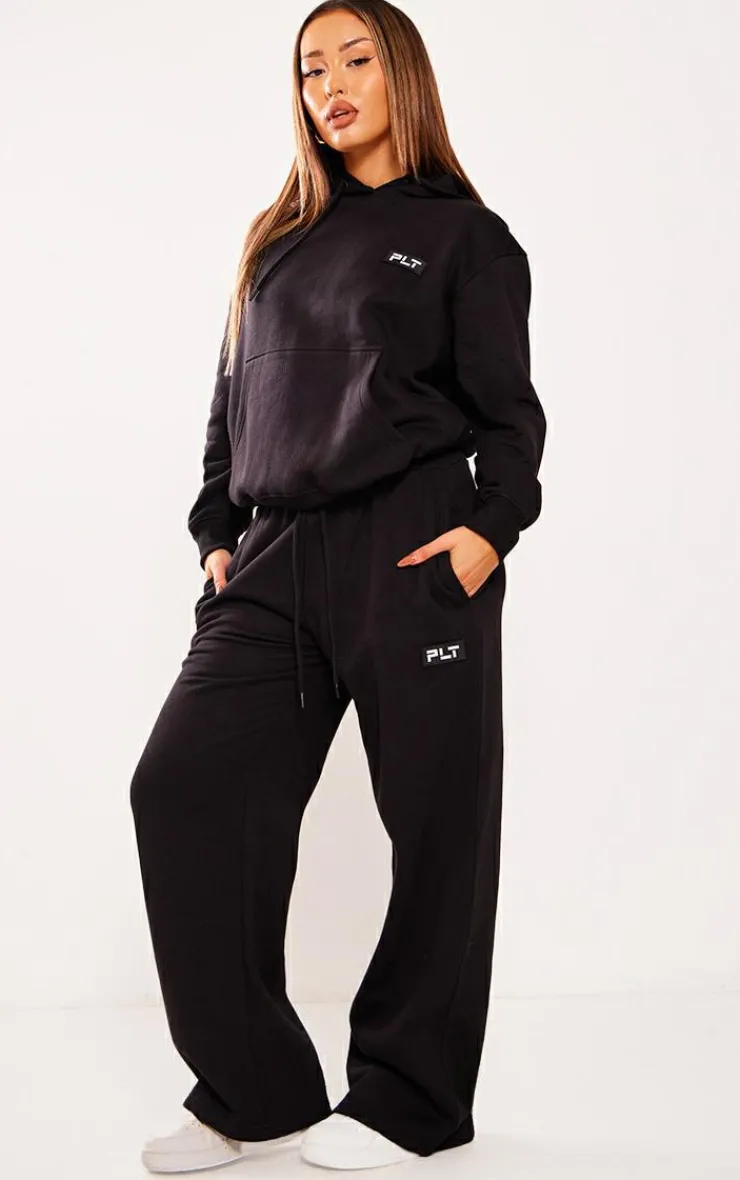 Best PrettyLittleThing Petite Badge Detail Straight Leg Sweatpants Black