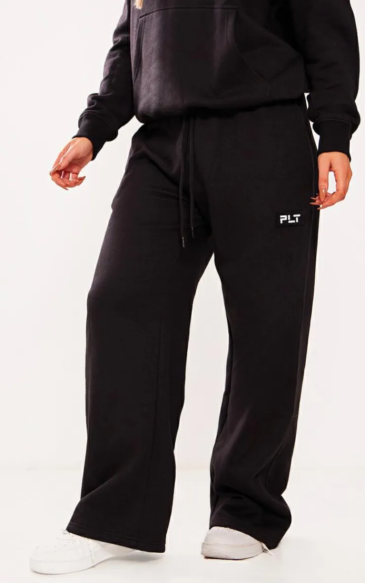 Best PrettyLittleThing Petite Badge Detail Straight Leg Sweatpants Black