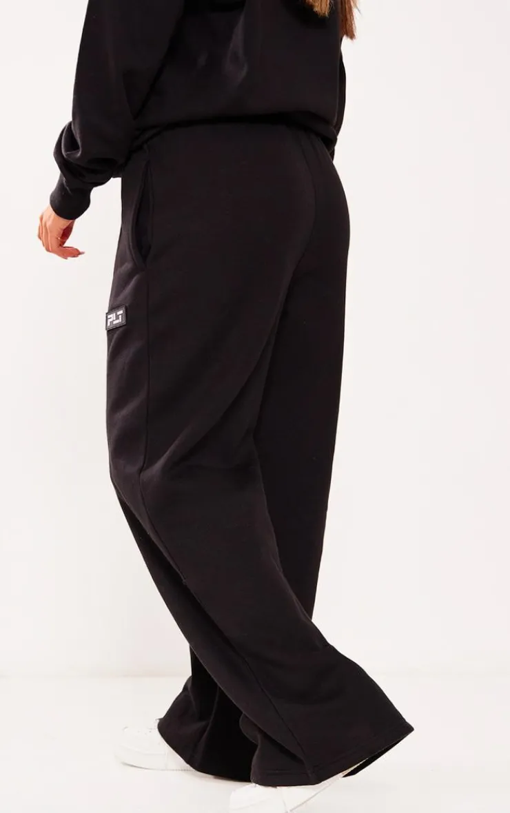 Best PrettyLittleThing Petite Badge Detail Straight Leg Sweatpants Black