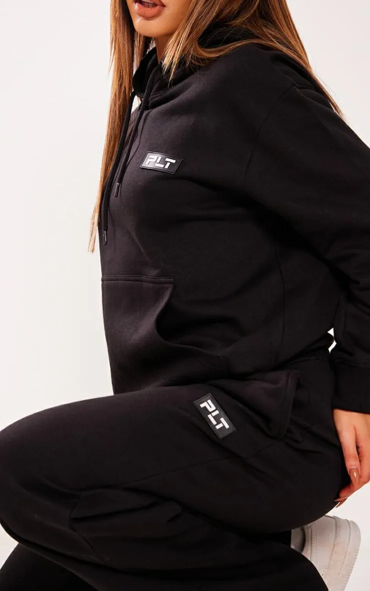 Best PrettyLittleThing Petite Badge Detail Straight Leg Sweatpants Black