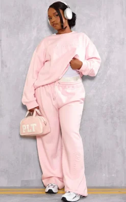 Online PrettyLittleThing Plus Embossed Graphic Straight Leg Sweatpants Baby Pink