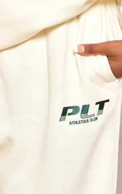PrettyLittleThing Cream Sweatsuits*Plus Athletics Club Embroidered Wide Leg Sweatpants