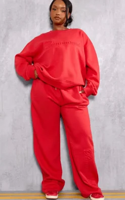 Sale PrettyLittleThing Plus Embossed Graphic Straight Leg Sweatpants Red