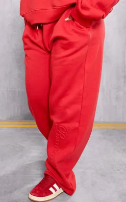 Sale PrettyLittleThing Plus Embossed Graphic Straight Leg Sweatpants Red